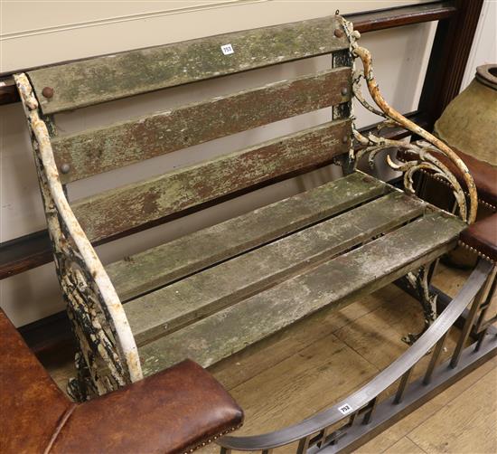 A rustic style cast iron garden bench